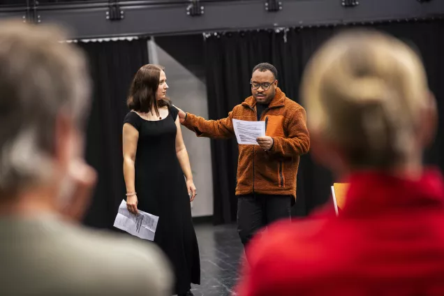 two person reading from a script