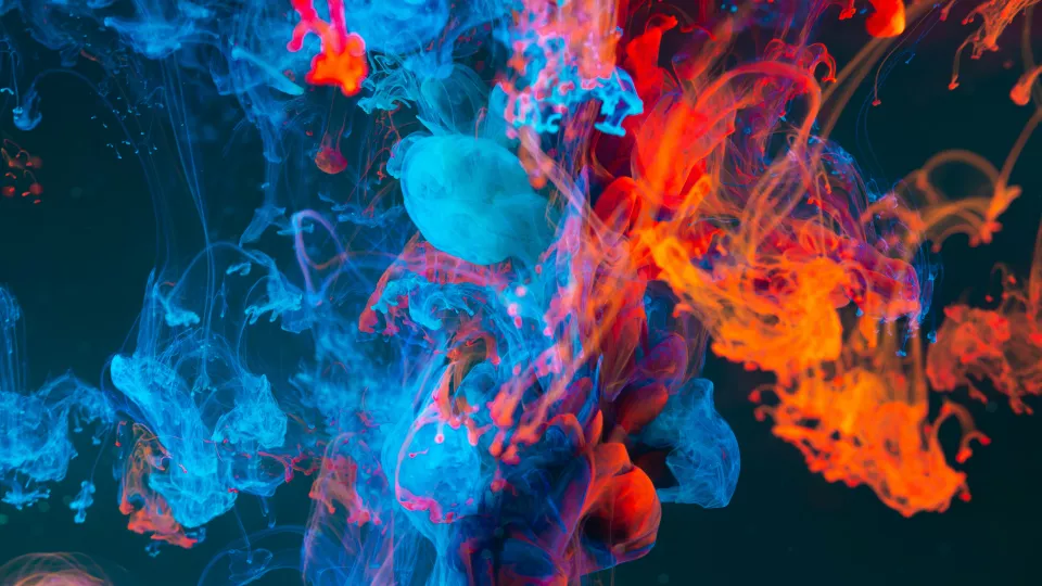 Abstract image. Colorful smoke with a dark background. Photo.